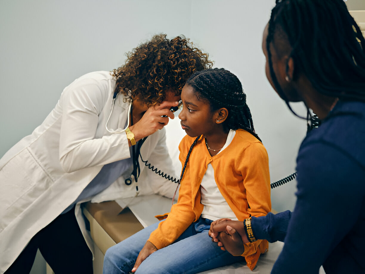 Ear doctor helping a patient with hearing aids in Limpopo.